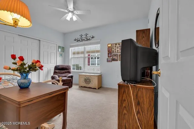 a view of a swimming pool with an outdoor space and seating area