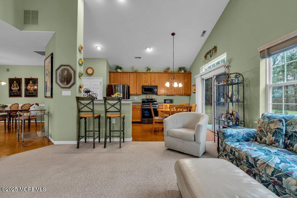 54 Drayton Road Manchester Township, NJ 08759 - Photo 9 of 93 a living room with furniture and kitchen view