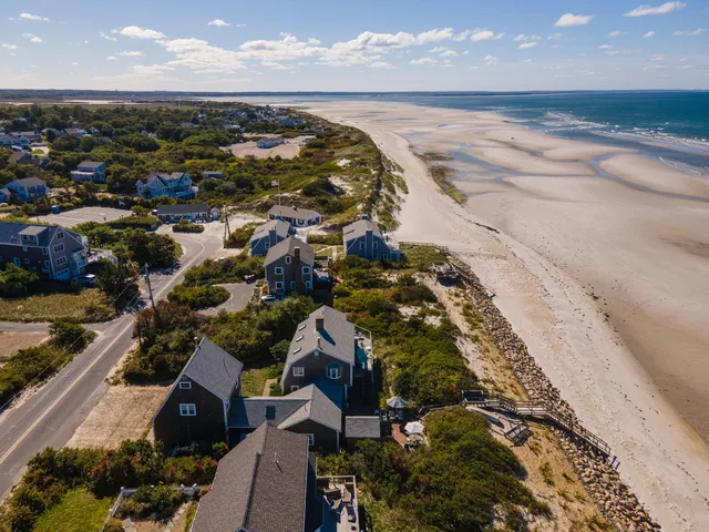 an aerial view of beach and ocean