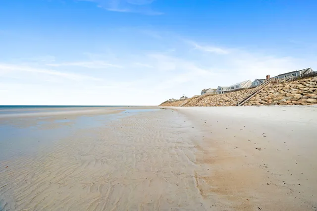 a bathroom with a sink a mirror and a bathtub
