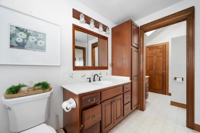 a kitchen with a sink a refrigerator and window