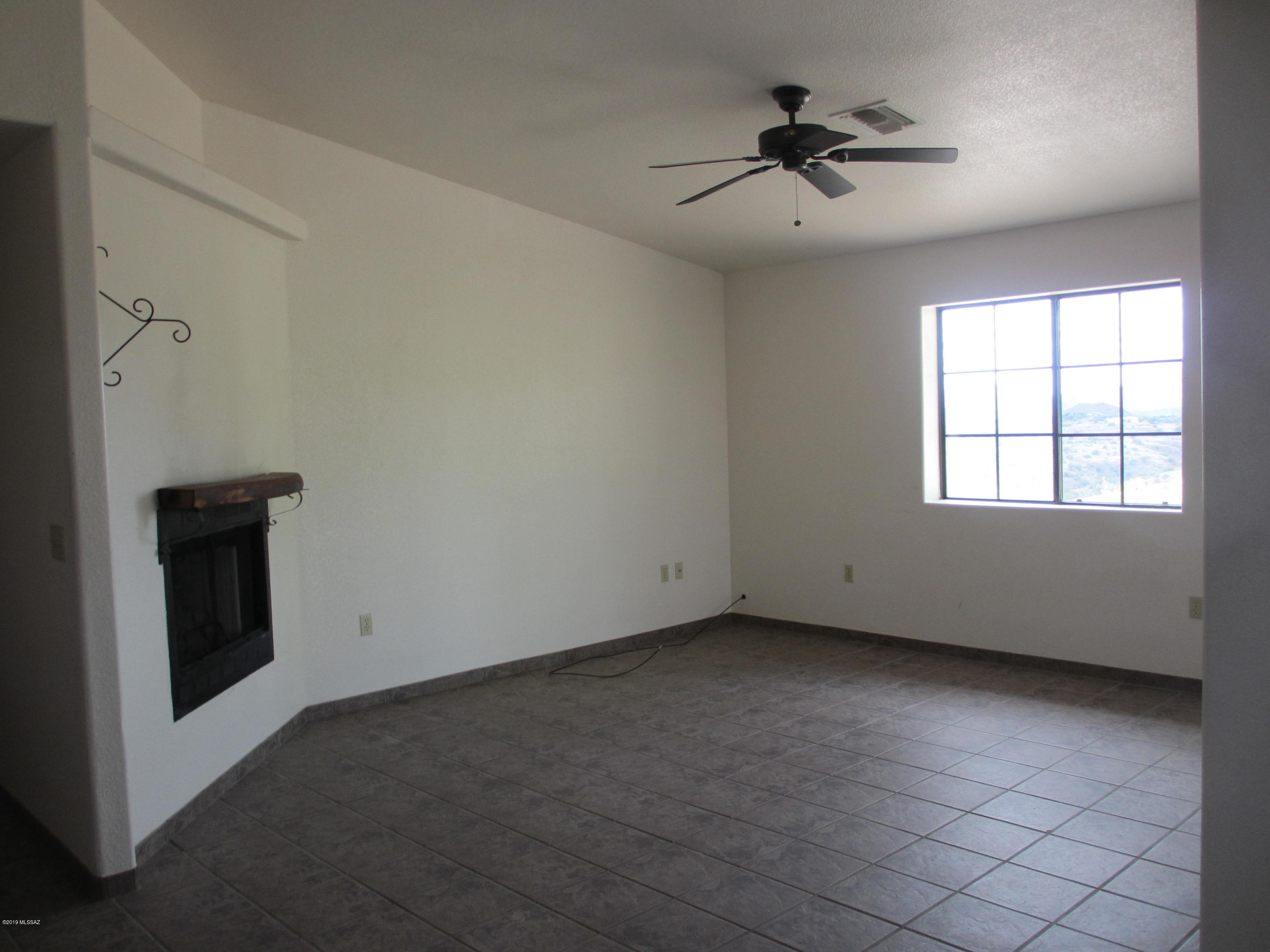 1084 Paseo Guebabi Rio Rico, AZ 85648 - Photo 16 of 33 a view of an empty room with a window