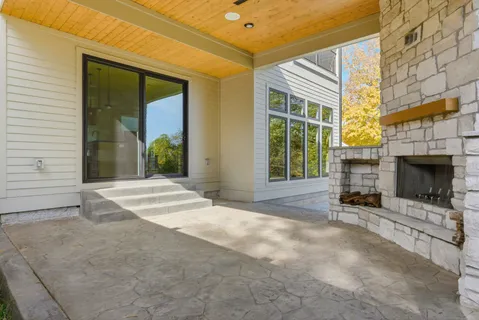 a view of a house with a yard and sitting area