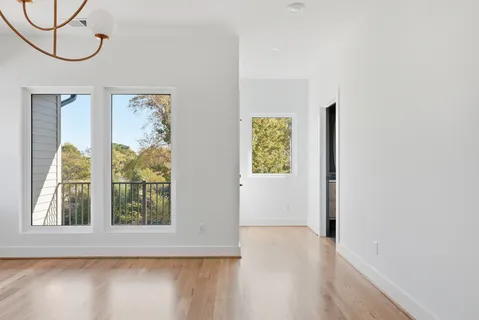 a view of an entryway with wooden floor and windows