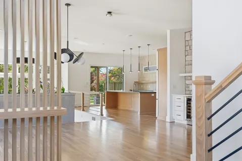 a view of staircase with white walls and windows