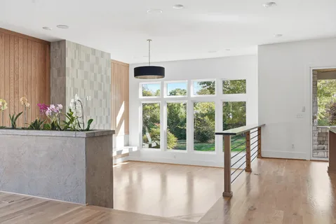 a view of kitchen with furniture and wooden floor