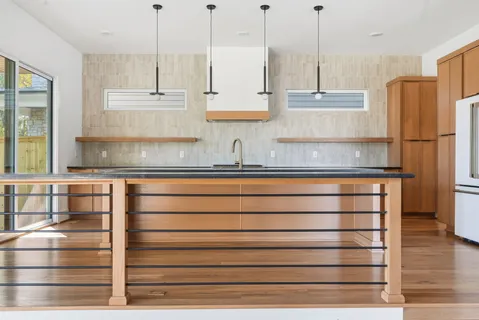 a kitchen with appliances cabinets and a counter