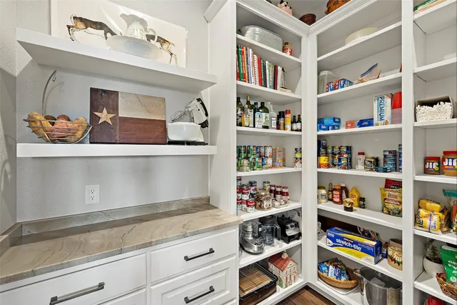 a kitchen with stainless steel appliances granite countertop a sink and a window