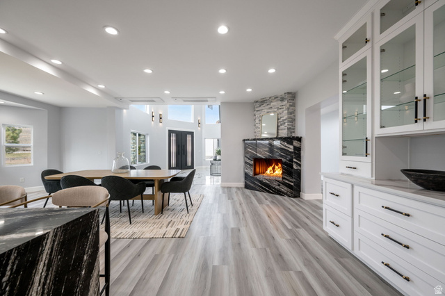 476 Spring Drive Toquerville, UT 84774 - Photo 12 of 95 Dining space featuring a large fireplace, light wood-type flooring, and recessed lighting