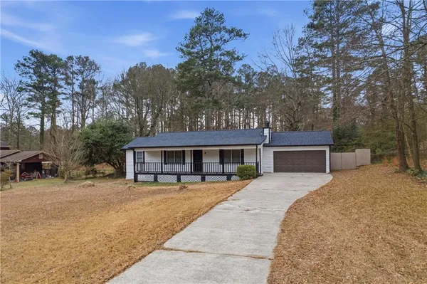 a house with trees in front of it