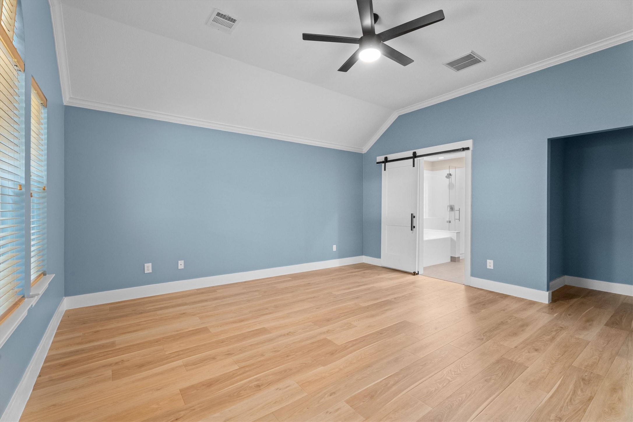 30111 Granum Drive Spring, TX 77386 - Photo 31 of 45 a view of an empty room with wooden floor and a window