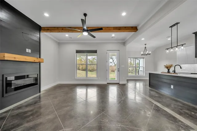 a view of a kitchen with a sink and a stove top oven