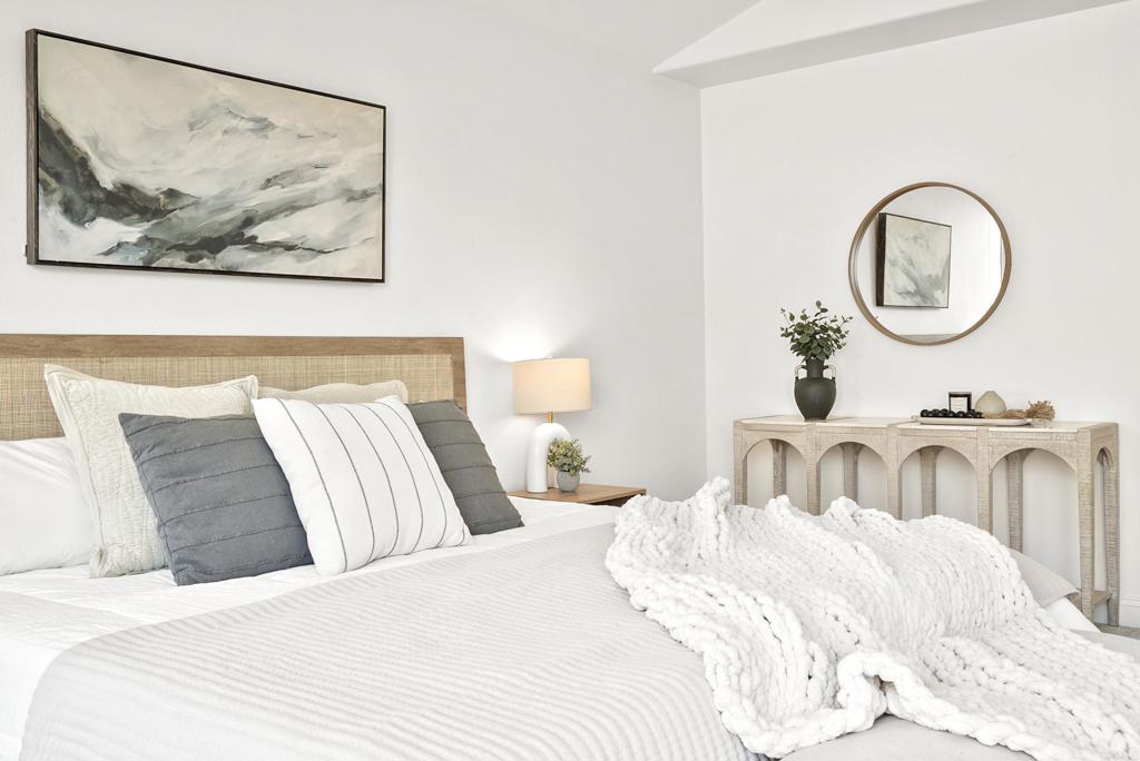 205 Terramar San Clemente, CA 92673 - Photo 30 of 62 a bedroom with a large bed and a chandelier