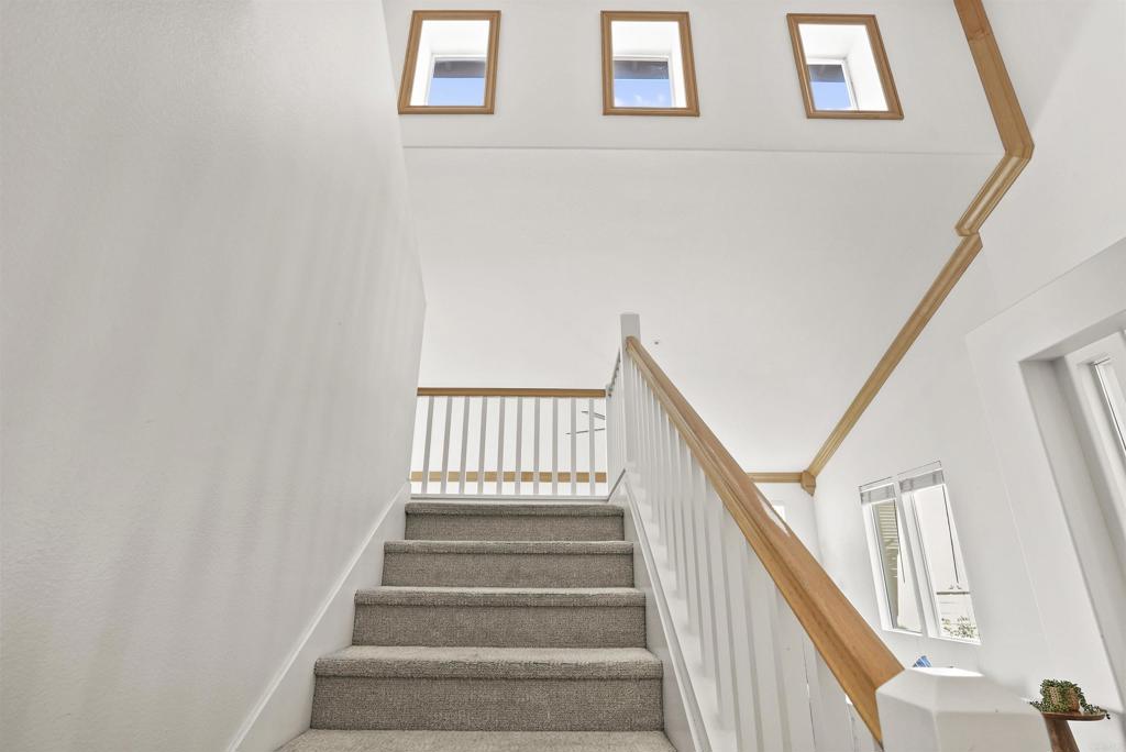 205 Terramar San Clemente, CA 92673 - Photo 46 of 62 a view of staircase with wooden floor and white walls