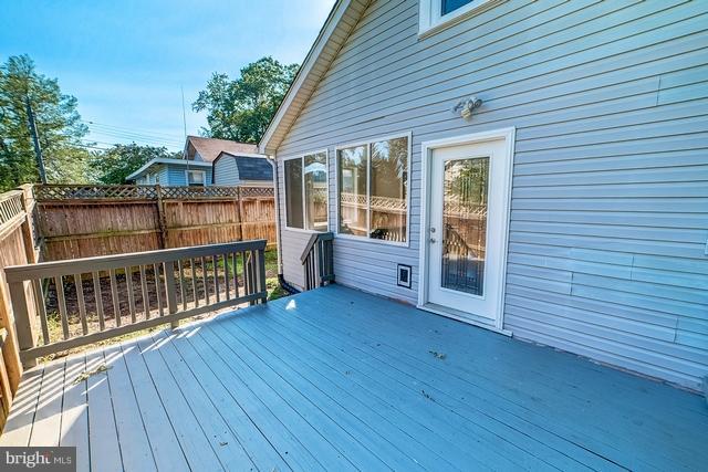 6 Dogwood Road Riva, MD 21140 - Photo 20 of 25 a view of a deck with wooden floor and fence next to a yard
