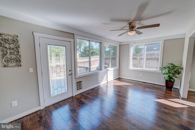 6 Dogwood Road Riva, MD 21140 - Photo 4 of 25 a view of an empty room with wooden floor and a window