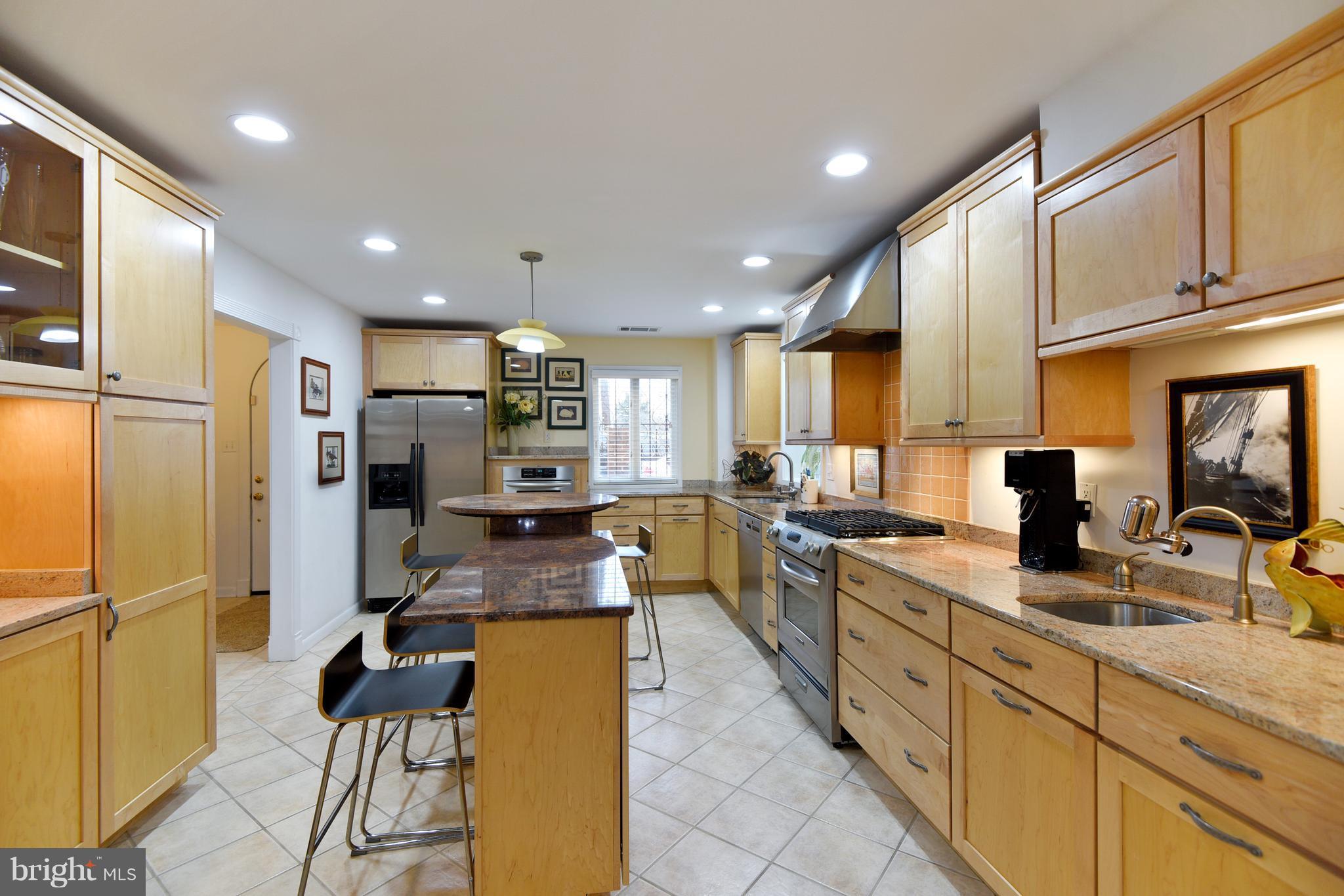 309 Fourth Street Annapolis, MD 21403 - Photo 5 of 30 a large kitchen with stainless steel appliances lots of counter top space