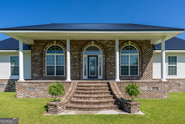 front view of a house with a yard