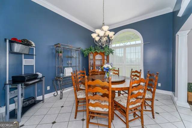 a living room with furniture and large windows