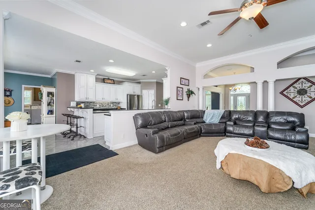 a view of a dining room with furniture window and outside view