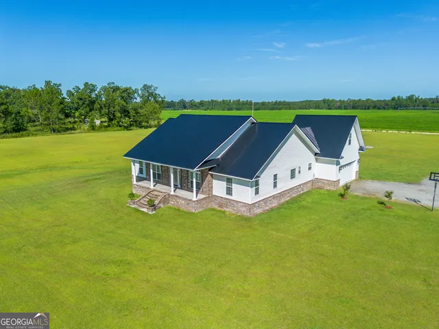 an aerial view of a house with a garden