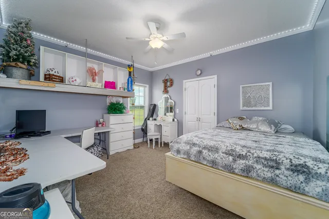 a spacious bathroom with a tub sink mirror and a toilet