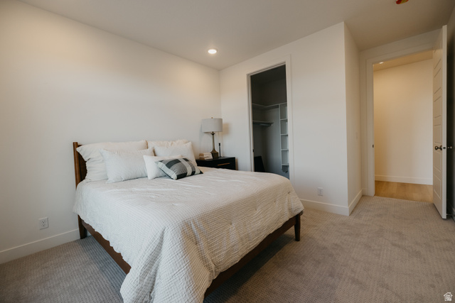 2759 Becco Trail, Unit 16 St. George, UT 84770 - Photo 32 of 42 Bedroom featuring a spacious closet, light colored carpet, and recessed lighting