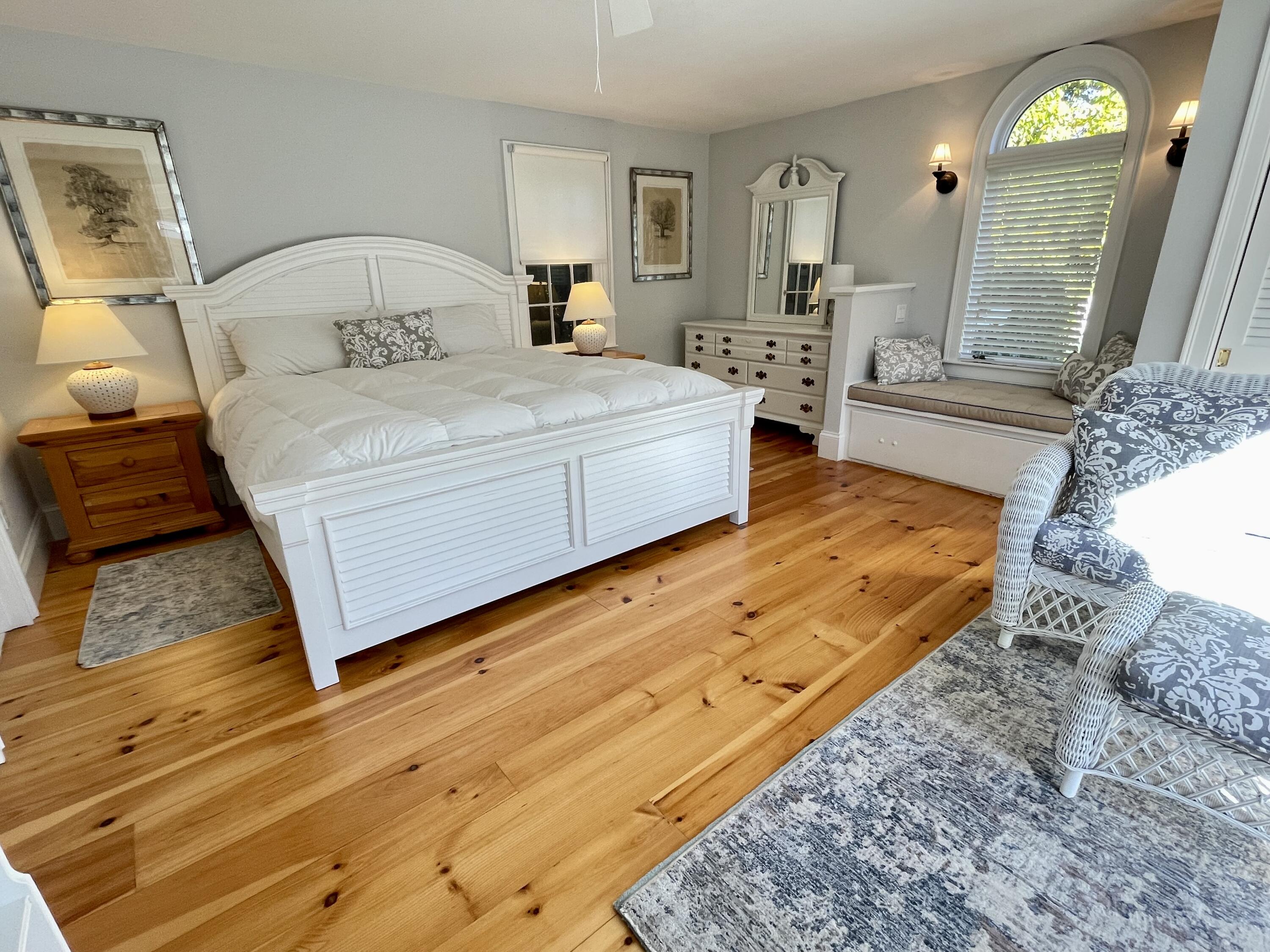 51 Beach Road Orleans, MA 02653 - Photo 29 of 46 a spacious bedroom with a bed a couch and dresser