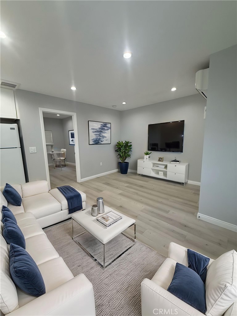 6504 Hesperia Avenue Reseda, CA 91335 - Photo 1 of 11 a living room with furniture and a flat screen tv