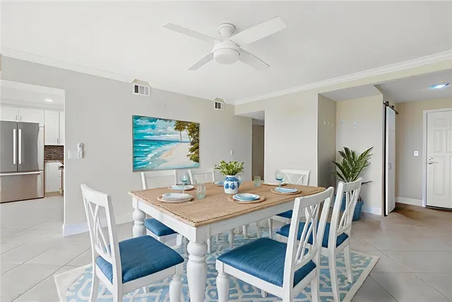 a kitchen with granite countertop a refrigerator stove and microwave