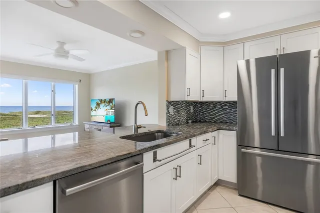 a bedroom with bed and a flat screen tv