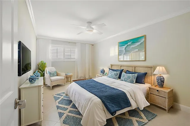a bedroom with a bed and a potted plant