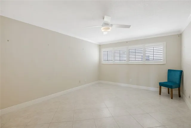 a living room with furniture and view of kitchen