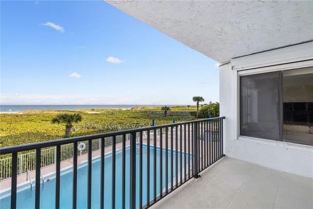 a view of a building and outdoor seating