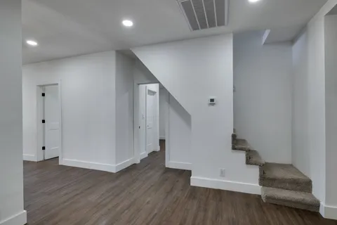 a view of entryway with wooden floor