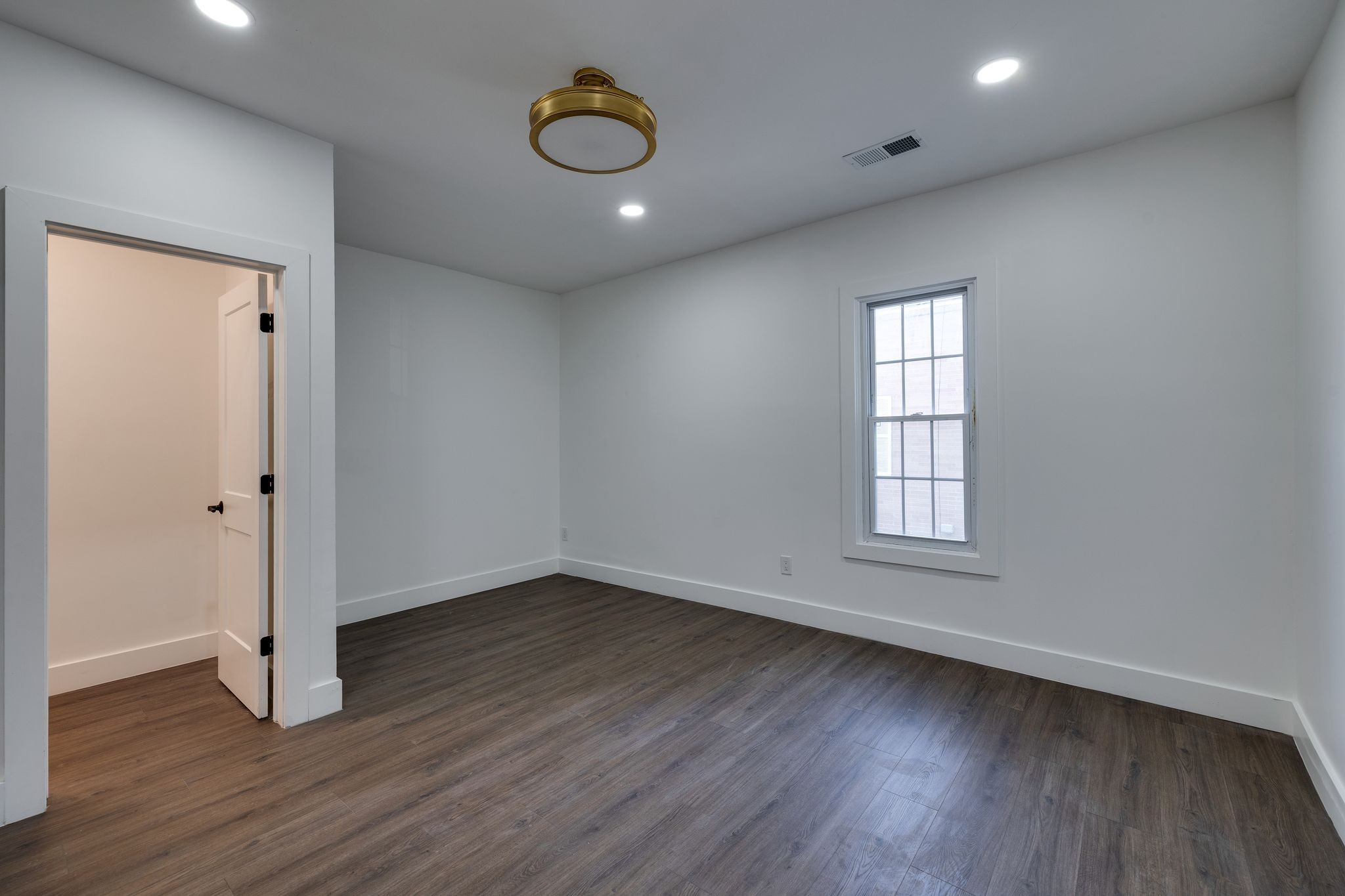 931 Glass Street Franklin, TN 37064 - Photo 16 of 31 an empty room with wooden floor and windows