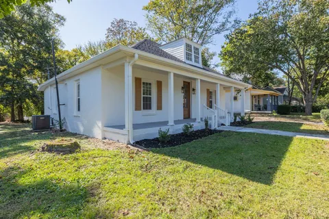 a view of a porch and garden