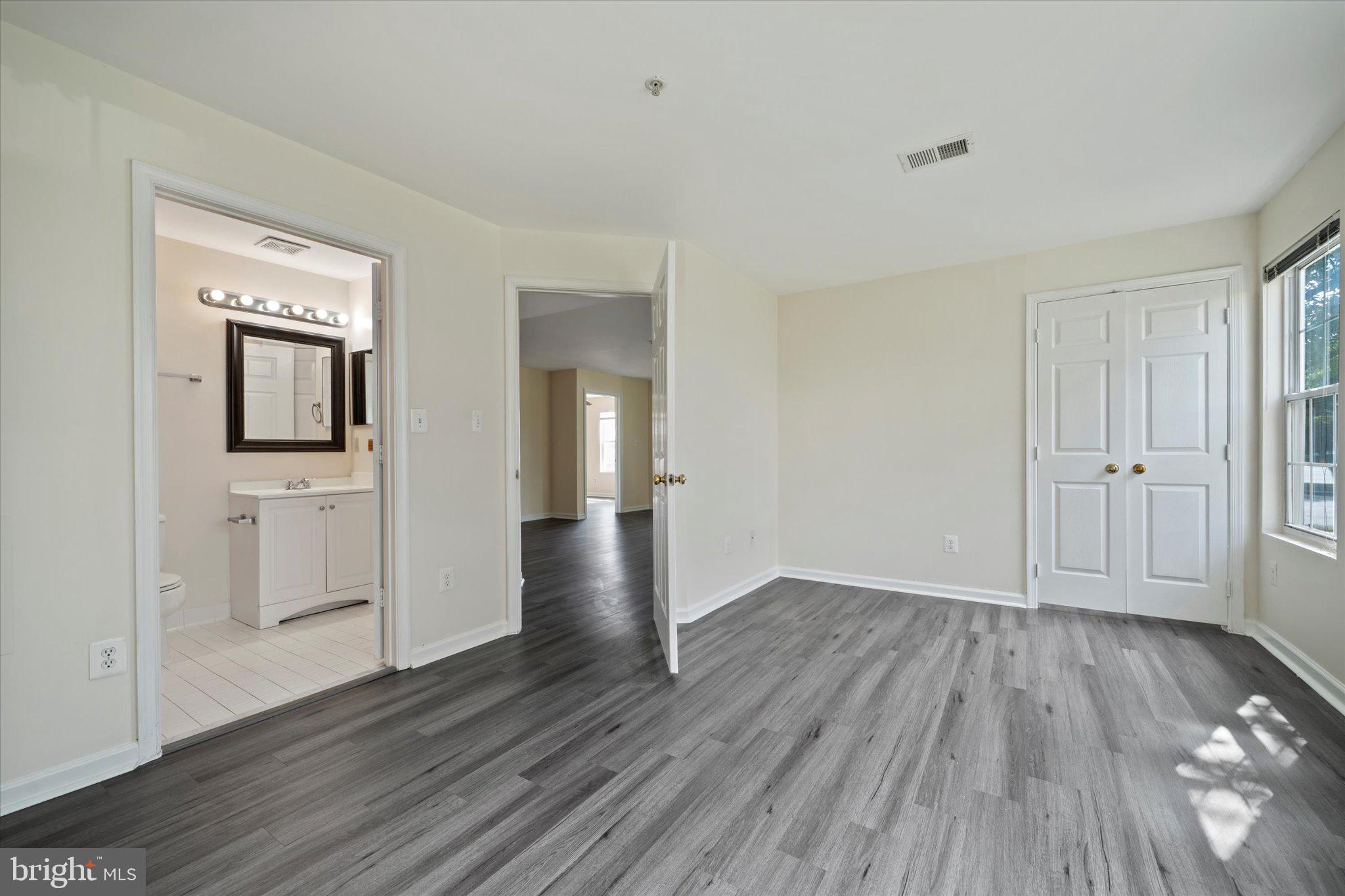 8083 Lacy Drive, Unit 101 Manassas, VA 20109 - Photo 19 of 31 wooden floor in an empty room
