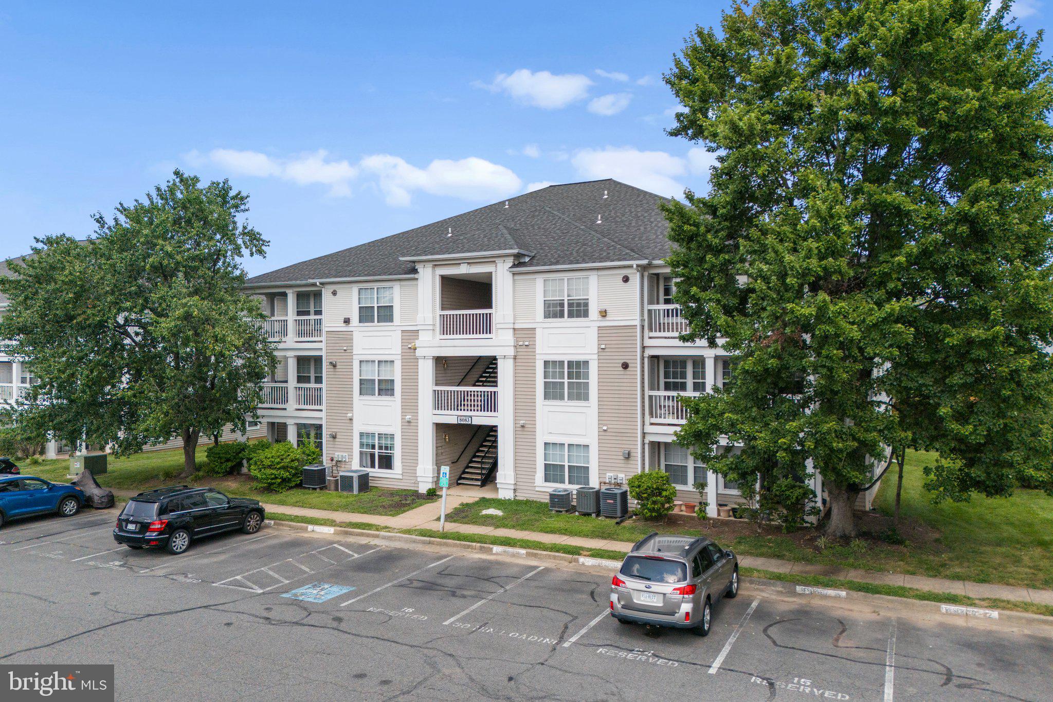 8083 Lacy Drive, Unit 101 Manassas, VA 20109 - Photo 20 of 31 a car parked in front of a house