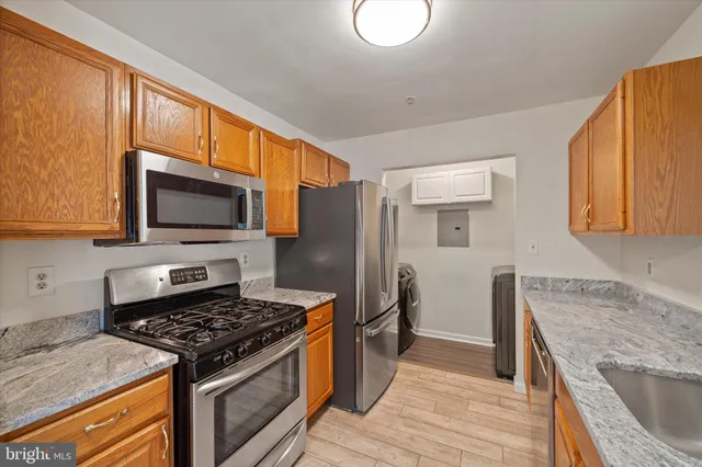a kitchen with a stove and a microwave