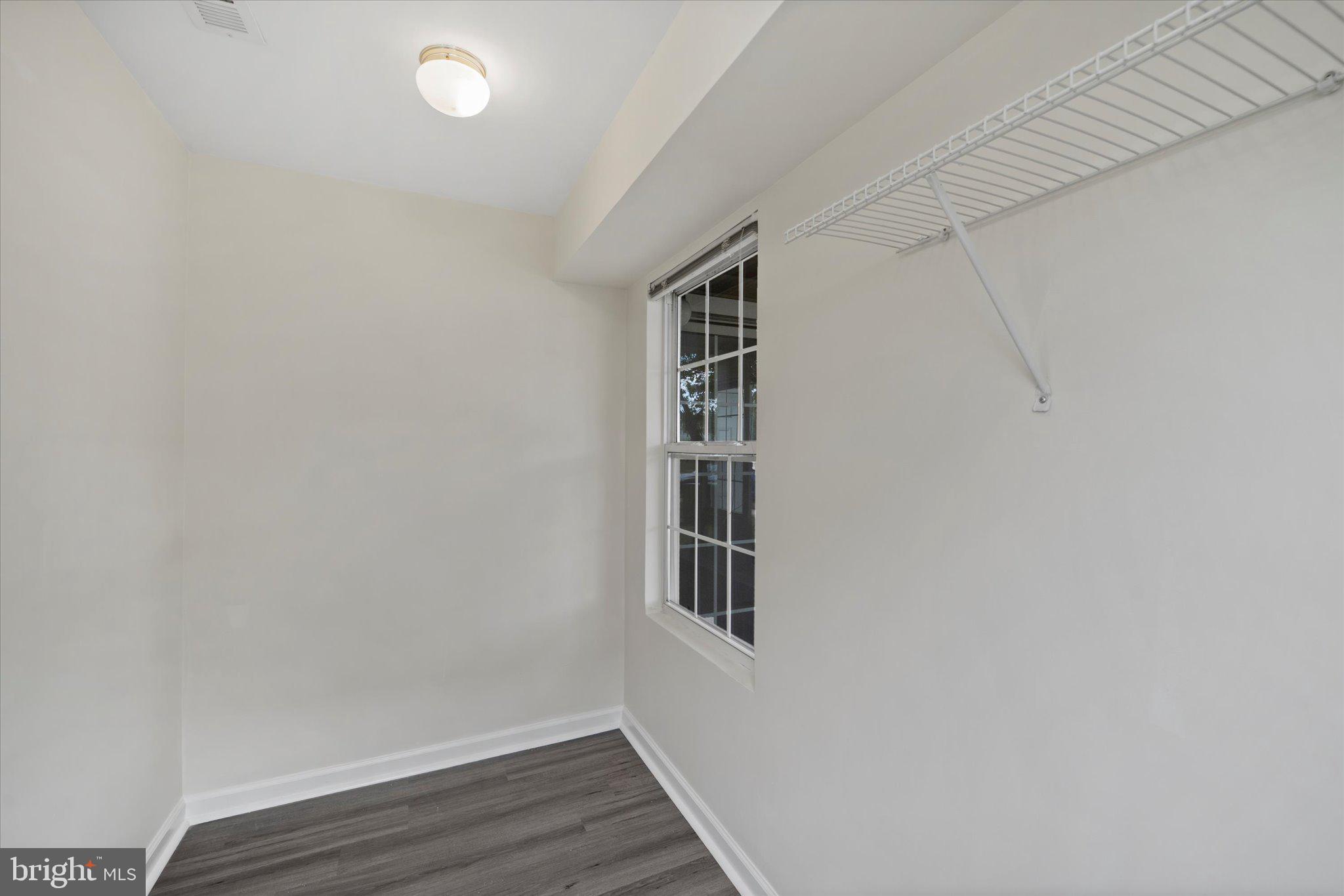 8083 Lacy Drive, Unit 101 Manassas, VA 20109 - Photo 24 of 31 a view of a room with wooden floor