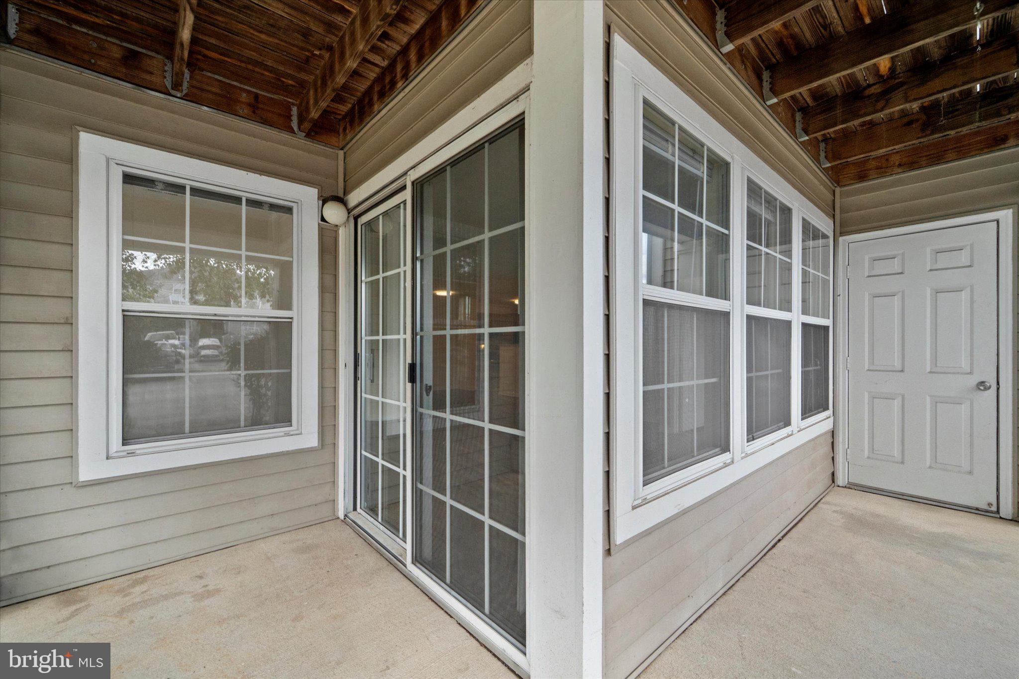 8083 Lacy Drive, Unit 101 Manassas, VA 20109 - Photo 27 of 31 a view of an empty room with a window