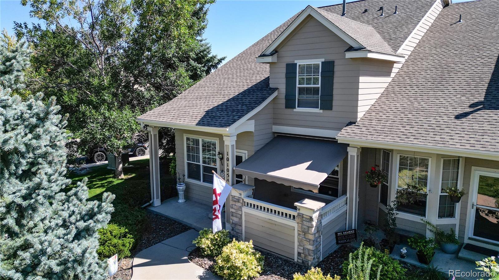 10105 North Grove Loop, Unit A Westminster, CO 80031 - Photo 1 of 40 a front view of a house with garden