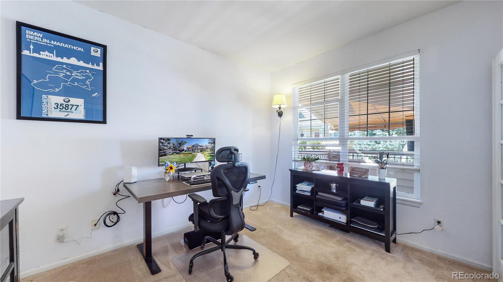 10105 North Grove Loop, Unit A Westminster, CO 80031 - Photo 12 of 40 a view of a workspace with furniture and a window