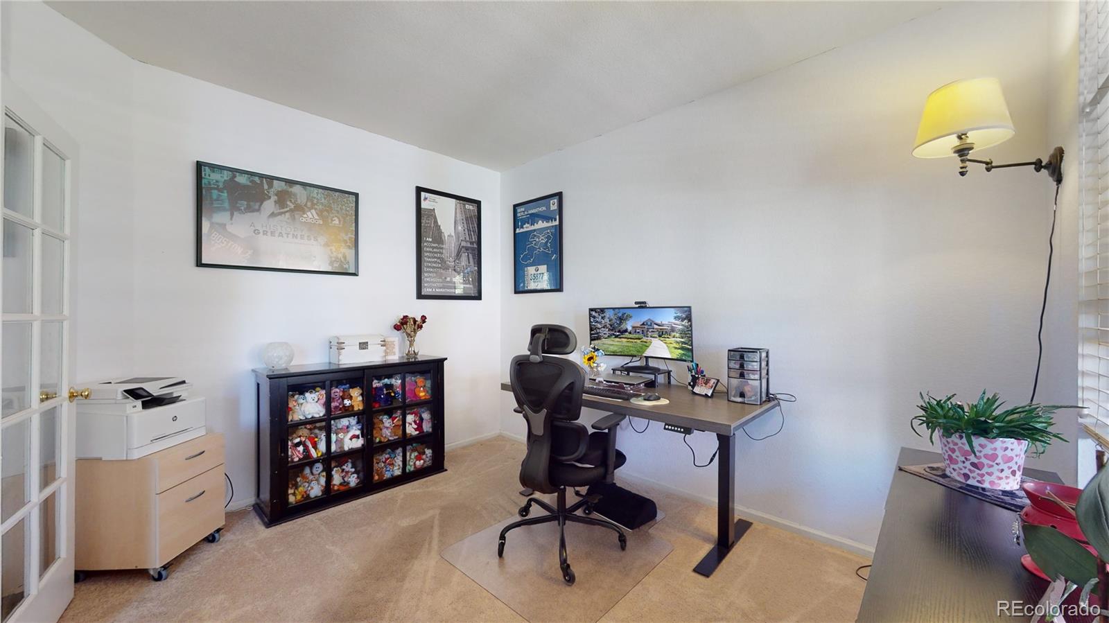 10105 North Grove Loop, Unit A Westminster, CO 80031 - Photo 13 of 40 a view of a workspace with furniture and toys