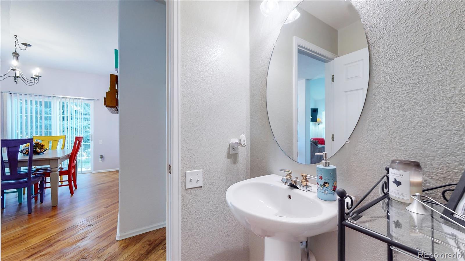 10105 North Grove Loop, Unit A Westminster, CO 80031 - Photo 14 of 40 a bathroom with a sink and a mirror