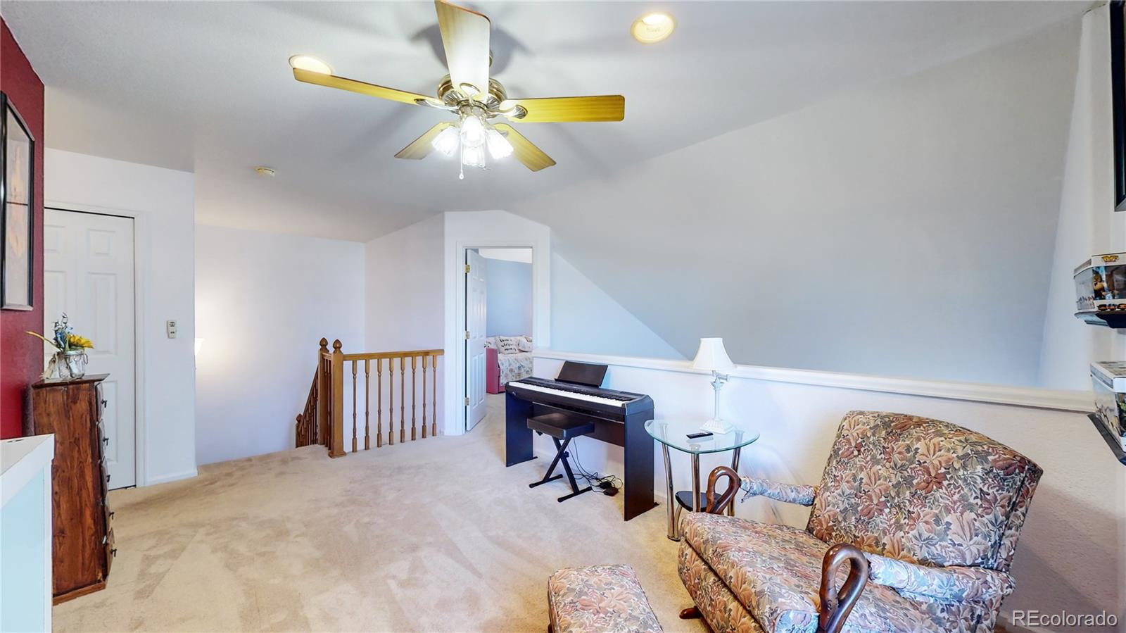 10105 North Grove Loop, Unit A Westminster, CO 80031 - Photo 16 of 40 a bedroom with furniture and a chandelier