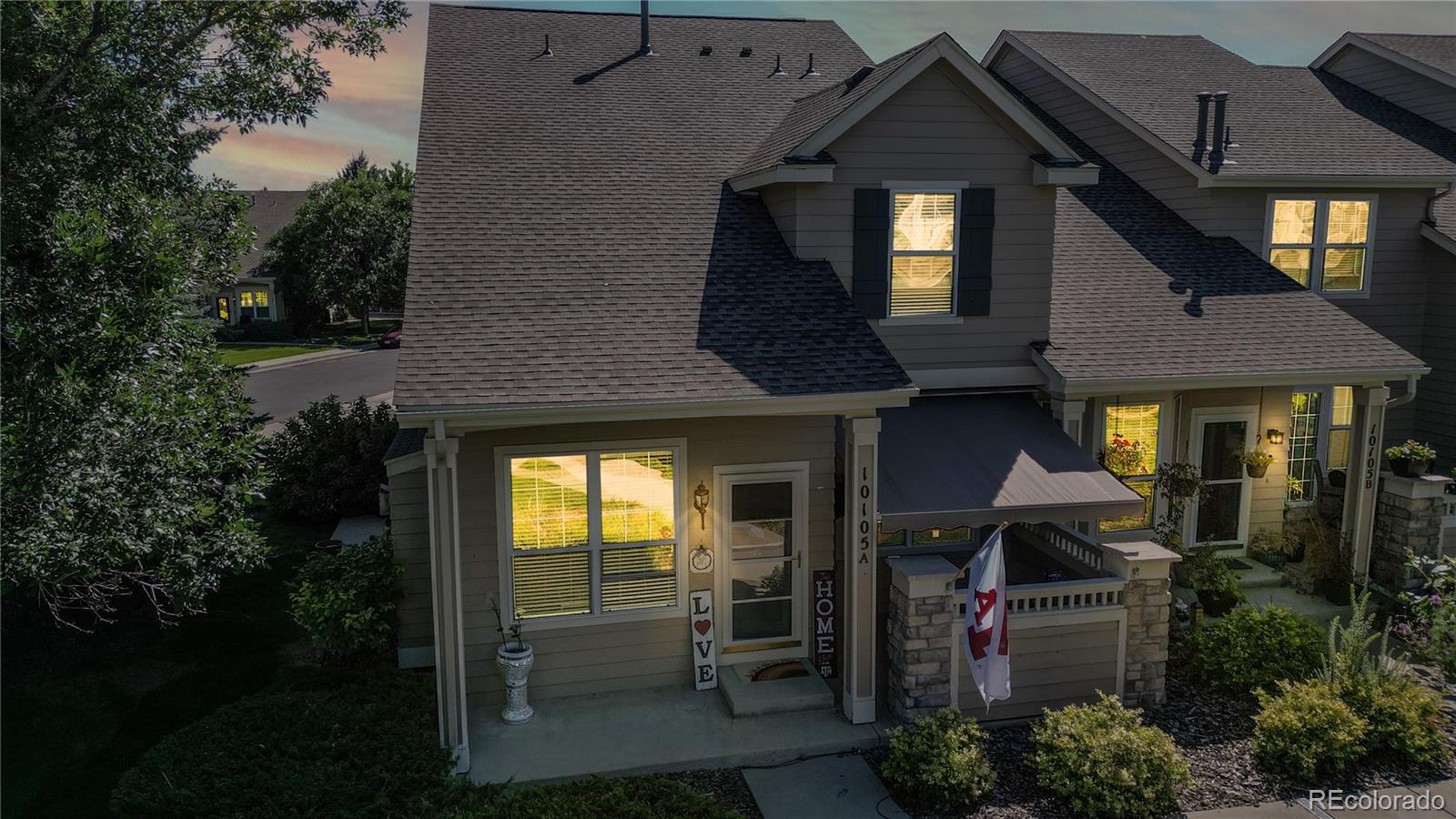10105 North Grove Loop, Unit A Westminster, CO 80031 - Photo 2 of 40 a view of a house with a outdoor space