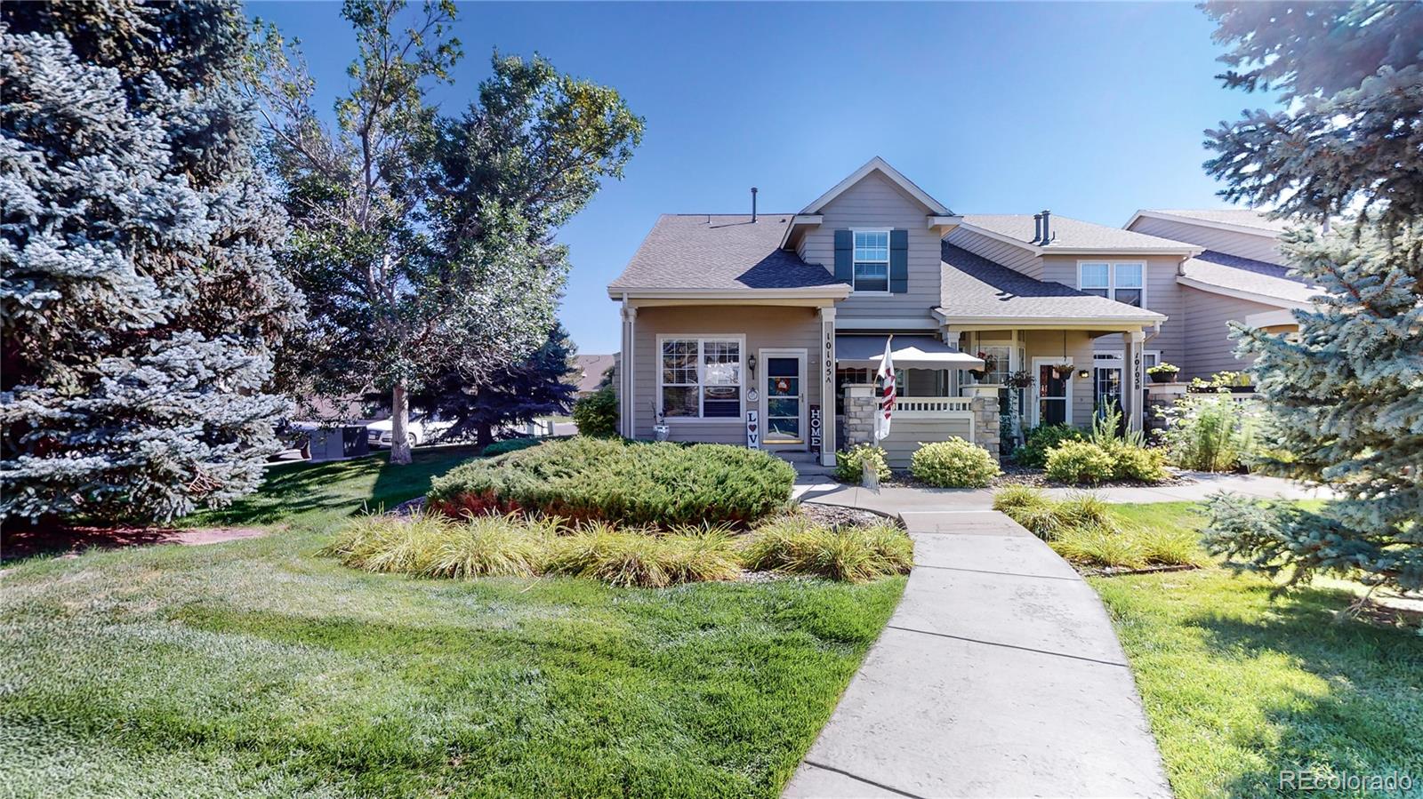 10105 North Grove Loop, Unit A Westminster, CO 80031 - Photo 37 of 40 a front view of house with yard and green space