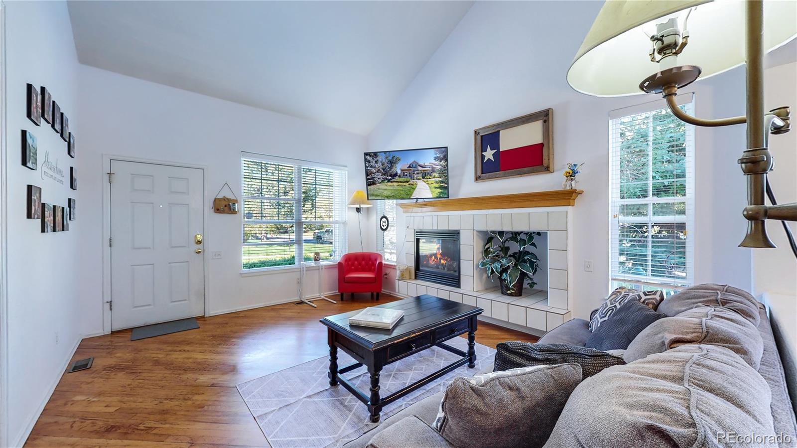 10105 North Grove Loop, Unit A Westminster, CO 80031 - Photo 6 of 40 a living room with furniture fireplace and window